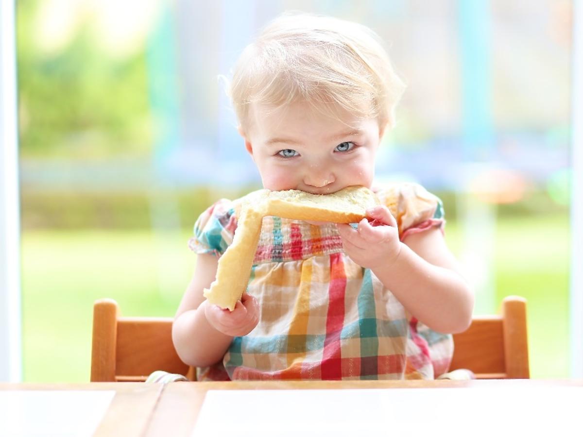 baby eating bread
