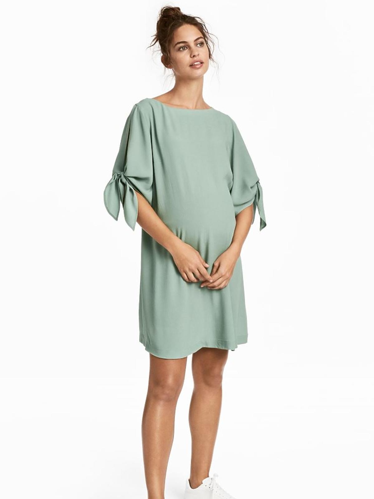 miętowa sukienka ciążowa H&M mini z efektownym wiązaniem przy rękawach